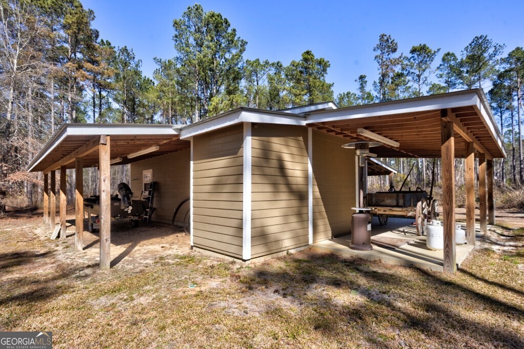 1401 Messex Road Millen, GA 30442 - Photo 19 of 51 a view of a house with a backyard and furniture