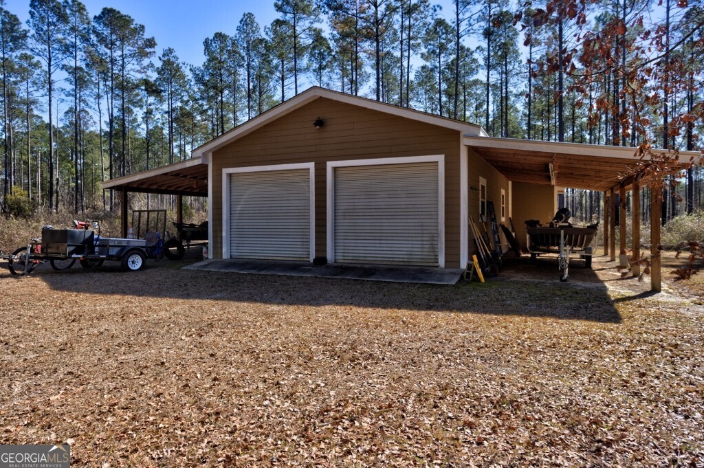 1401 Messex Road Millen, GA 30442 - Photo 20 of 51 a front view of a house with a yard