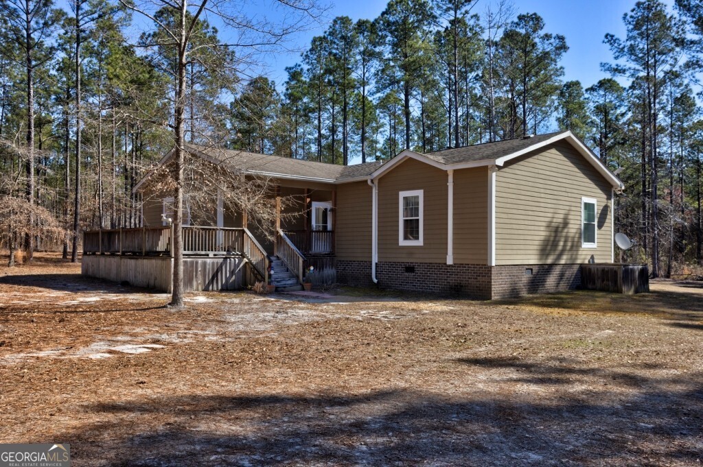 1401 Messex Road Millen, GA 30442 - Photo 9 of 51 a view of a house with a yard