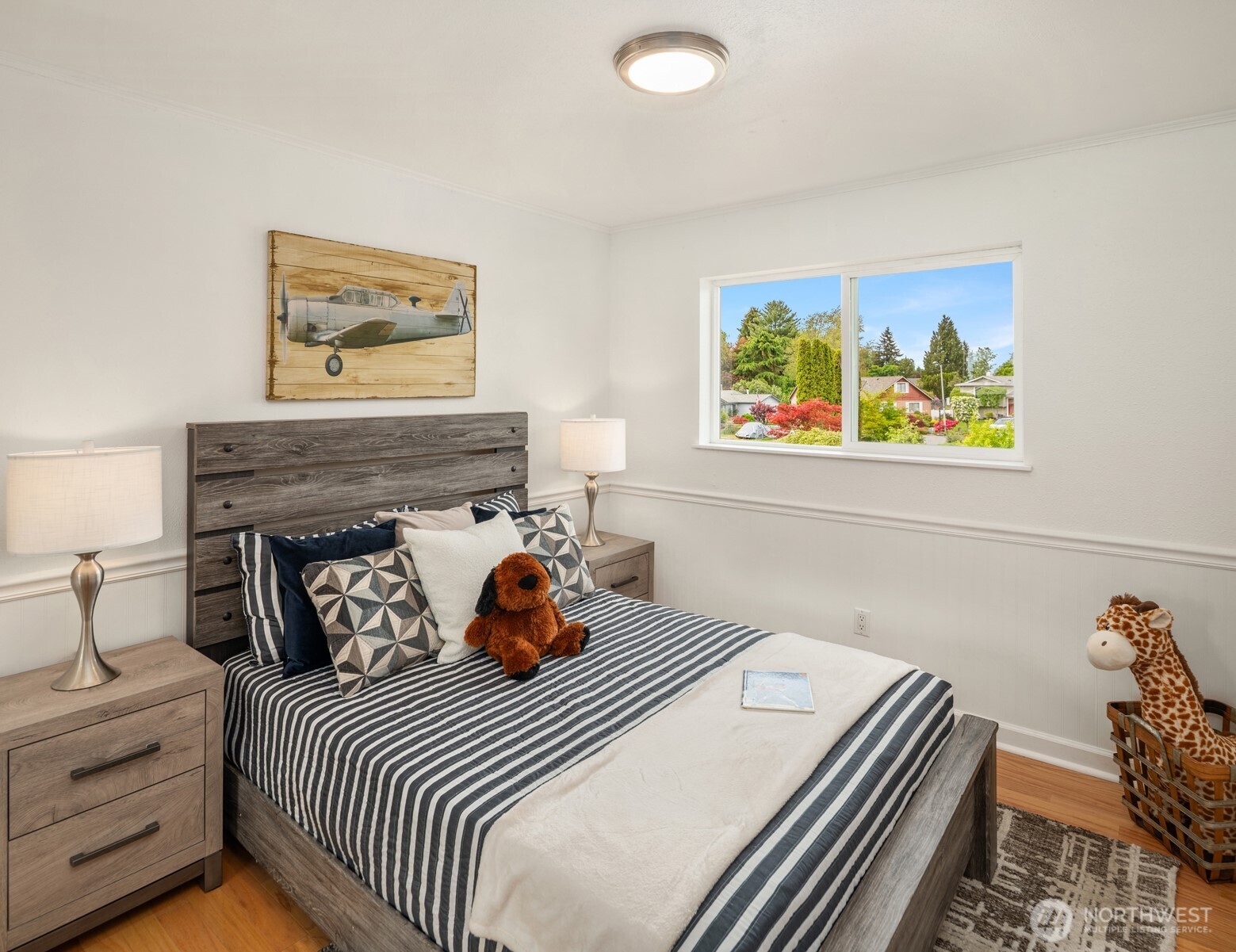 418 212th Street Southwest Bothell, WA 98021 - Photo 21 of 40 a bedroom with a bed and painting on the wall