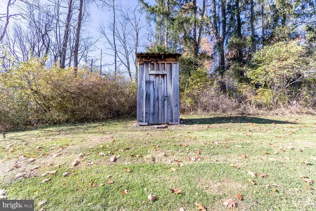 a view of a backyard of the house
