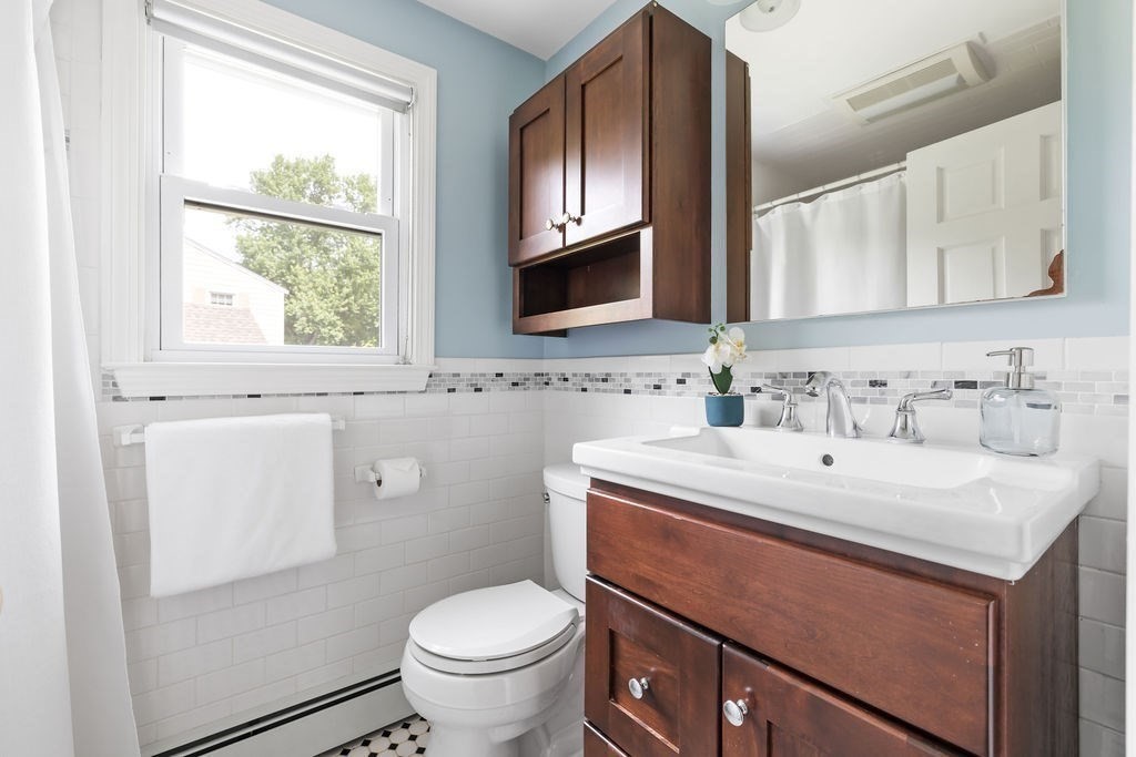21 Vanderbelt Road Acton, MA 01720 - Photo 19 of 36 a bathroom with a sink toilet and mirror