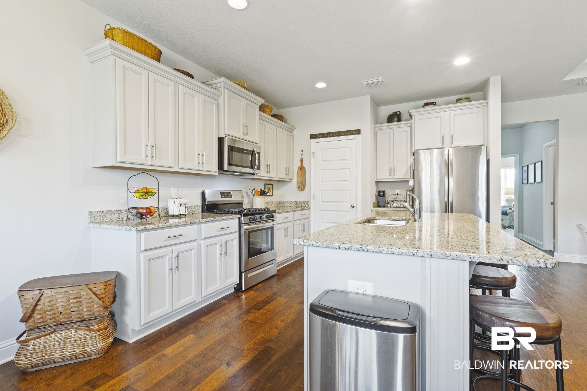 31663 Kestrel Loop Daphne, AL 36527 - Photo 22 of 86 Kitchen featuring appliances with stainless steel finishes, white cabinetry, sink, and dark wood-type flooring