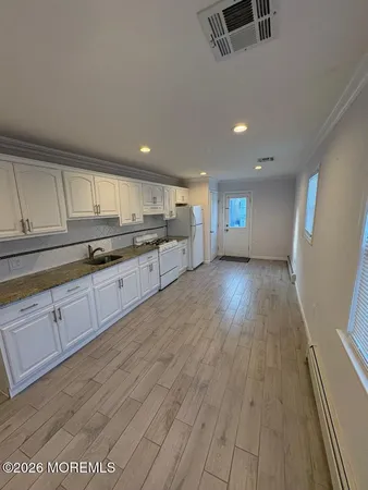 a large kitchen with cabinets