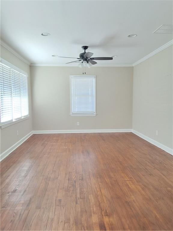 217 Bellview Street Winder, GA 30680 - Photo 3 of 10 wooden floor in an empty room with a window