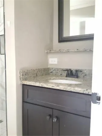 a view of a sink and a mirror