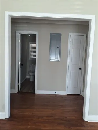 a view of a livingroom with wooden floor and closet