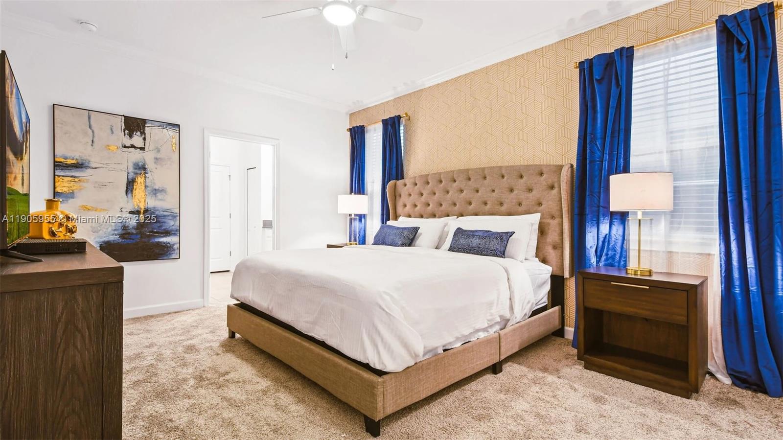 2993 Protagonist Street Kissimmee, FL 34746 - Photo 12 of 31 a bedroom with a bed and a night stand