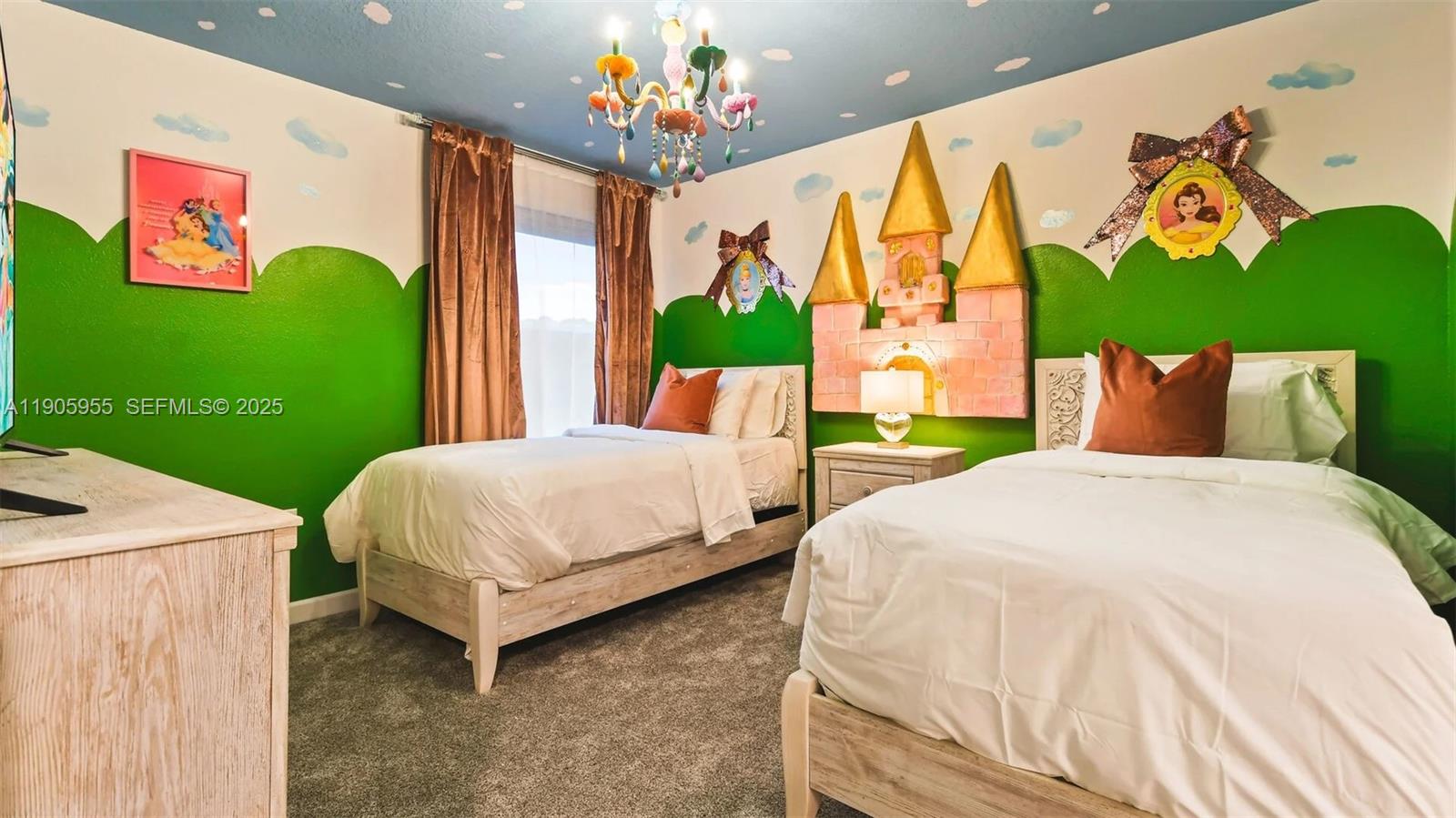 2993 Protagonist Street Kissimmee, FL 34746 - Photo 16 of 31 a bedroom with a bed chandelier and a window