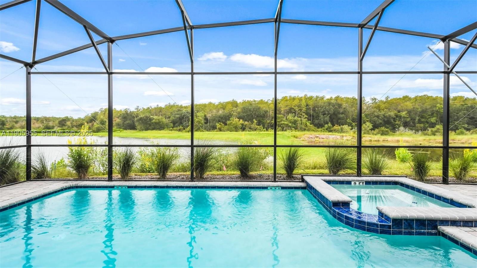 2993 Protagonist Street Kissimmee, FL 34746 - Photo 22 of 31 a view of an empty room with large windows and lake view