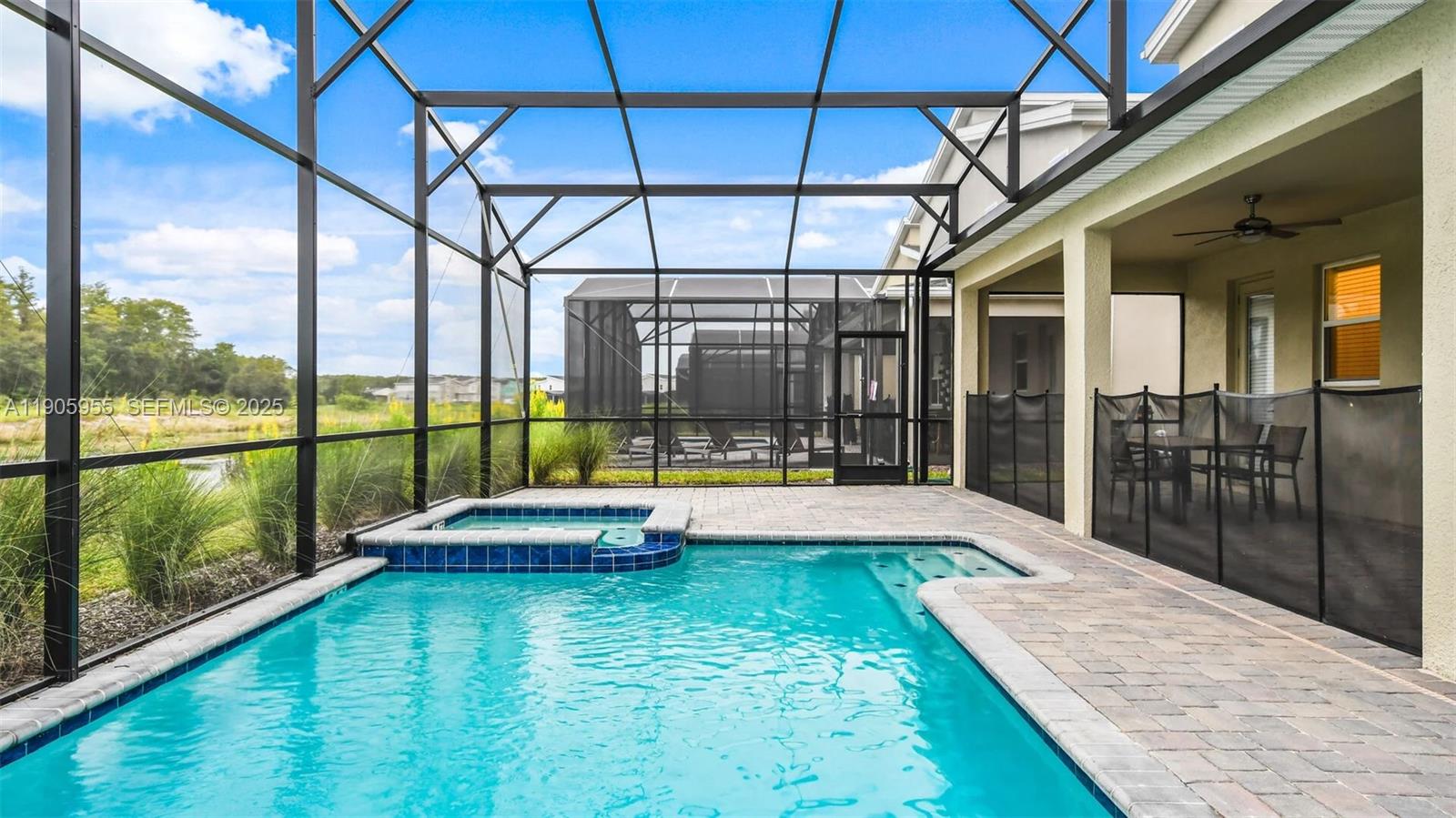 2993 Protagonist Street Kissimmee, FL 34746 - Photo 25 of 31 a swimming pool with large outdoor seating and yard