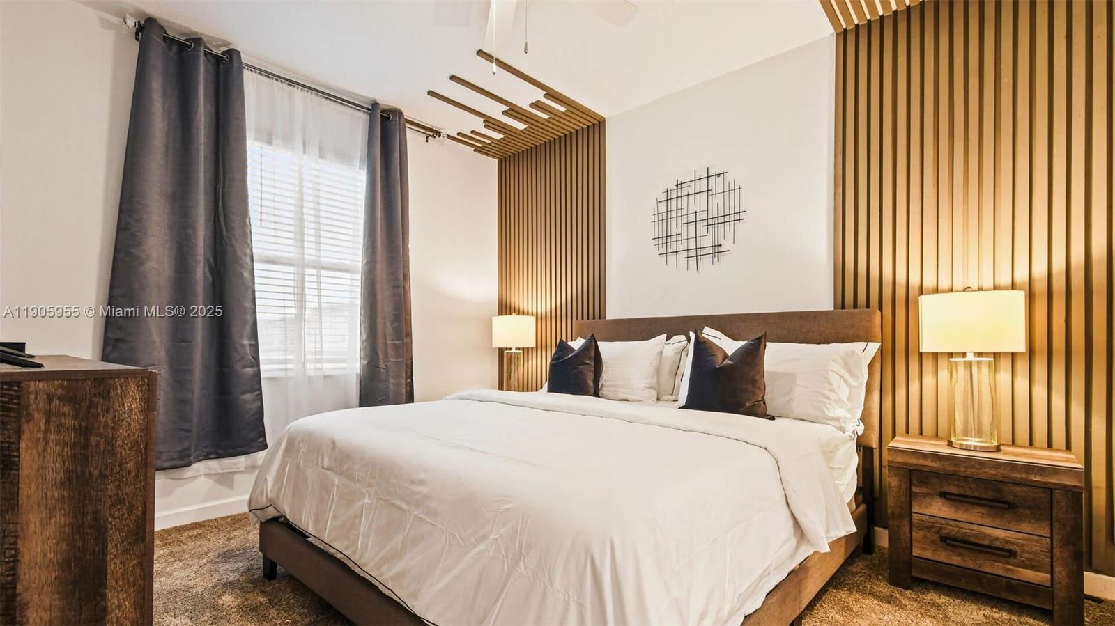 2993 Protagonist Street Kissimmee, FL 34746 - Photo 7 of 31 a bed sitting in a bedroom next to a window