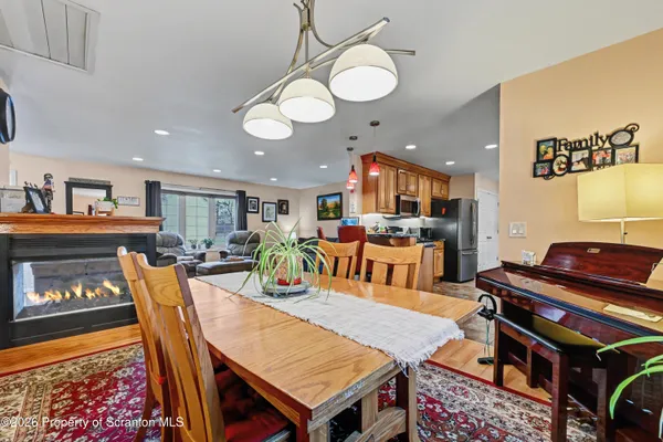 a kitchen with stainless steel appliances granite countertop a sink refrigerator and stove