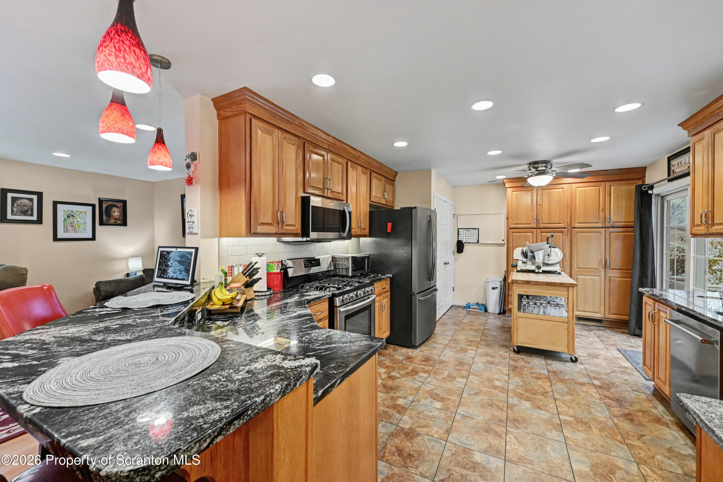 131 Front Street Jessup, PA 18434 - Photo 13 of 58 a kitchen with stainless steel appliances granite countertop a sink refrigerator and stove