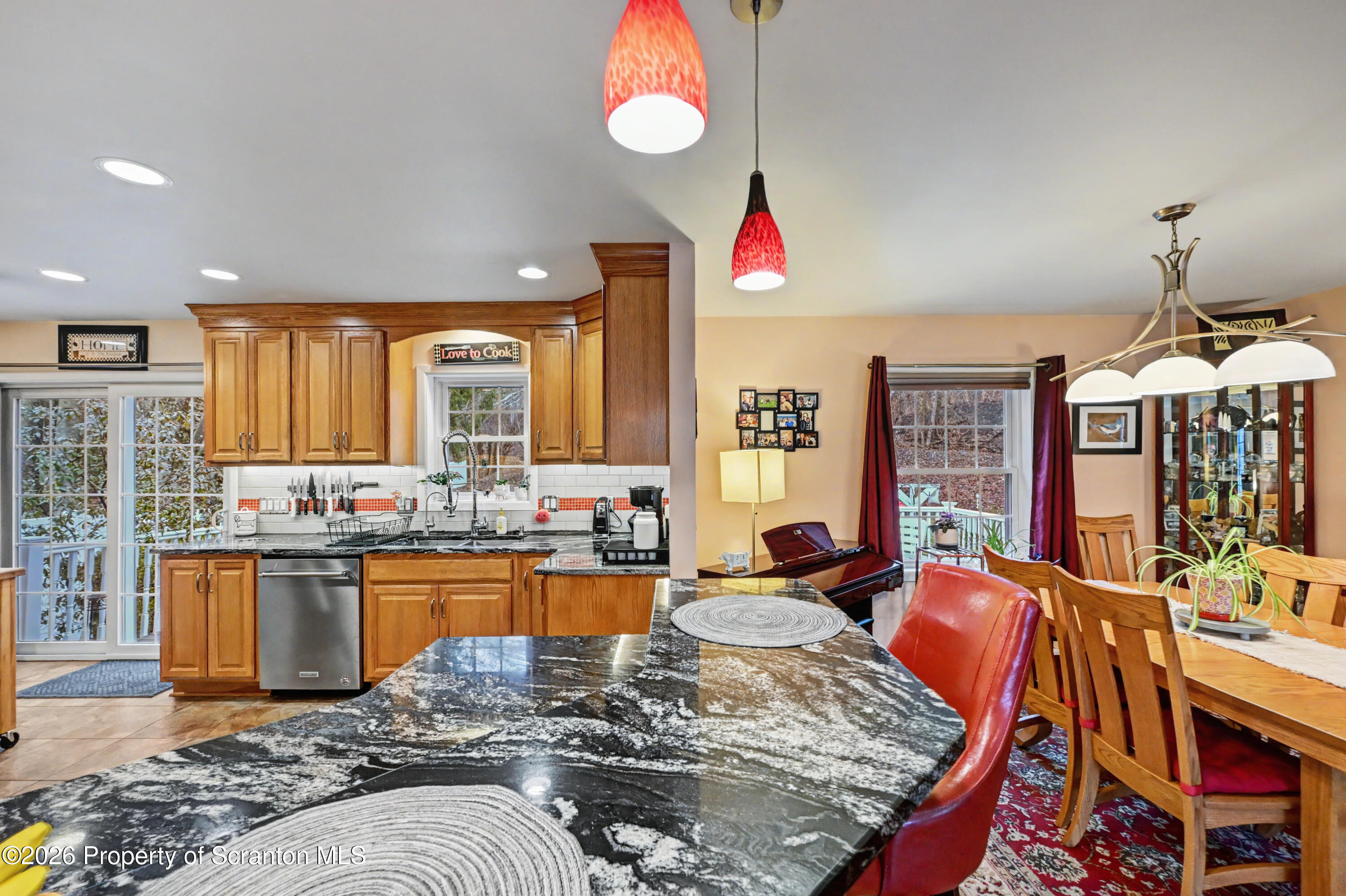 131 Front Street Jessup, PA 18434 - Photo 18 of 58 a living room with furniture kitchen view and a chandelier