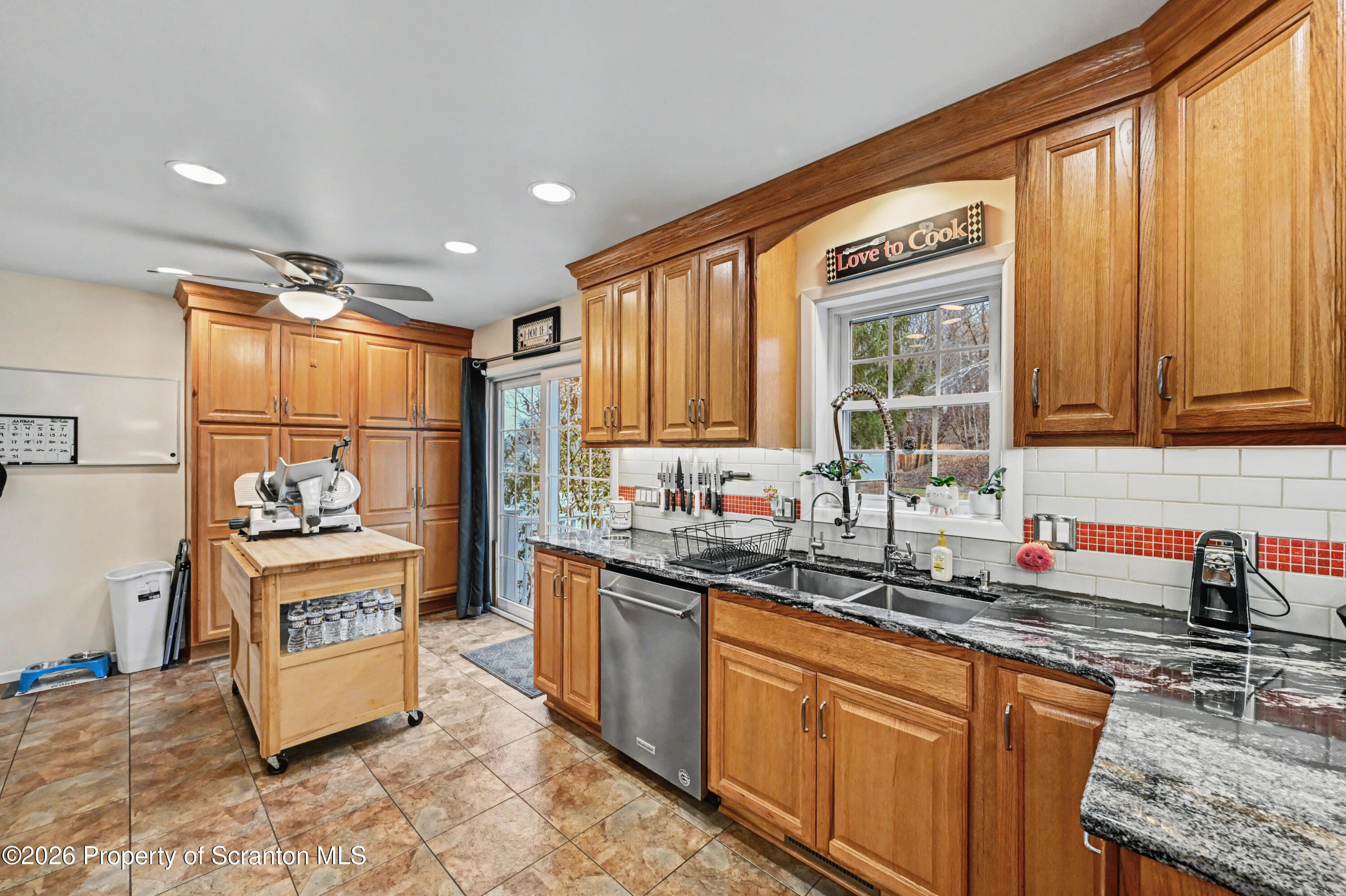 131 Front Street Jessup, PA 18434 - Photo 20 of 58 a kitchen with stainless steel appliances granite countertop a sink stove and cabinets