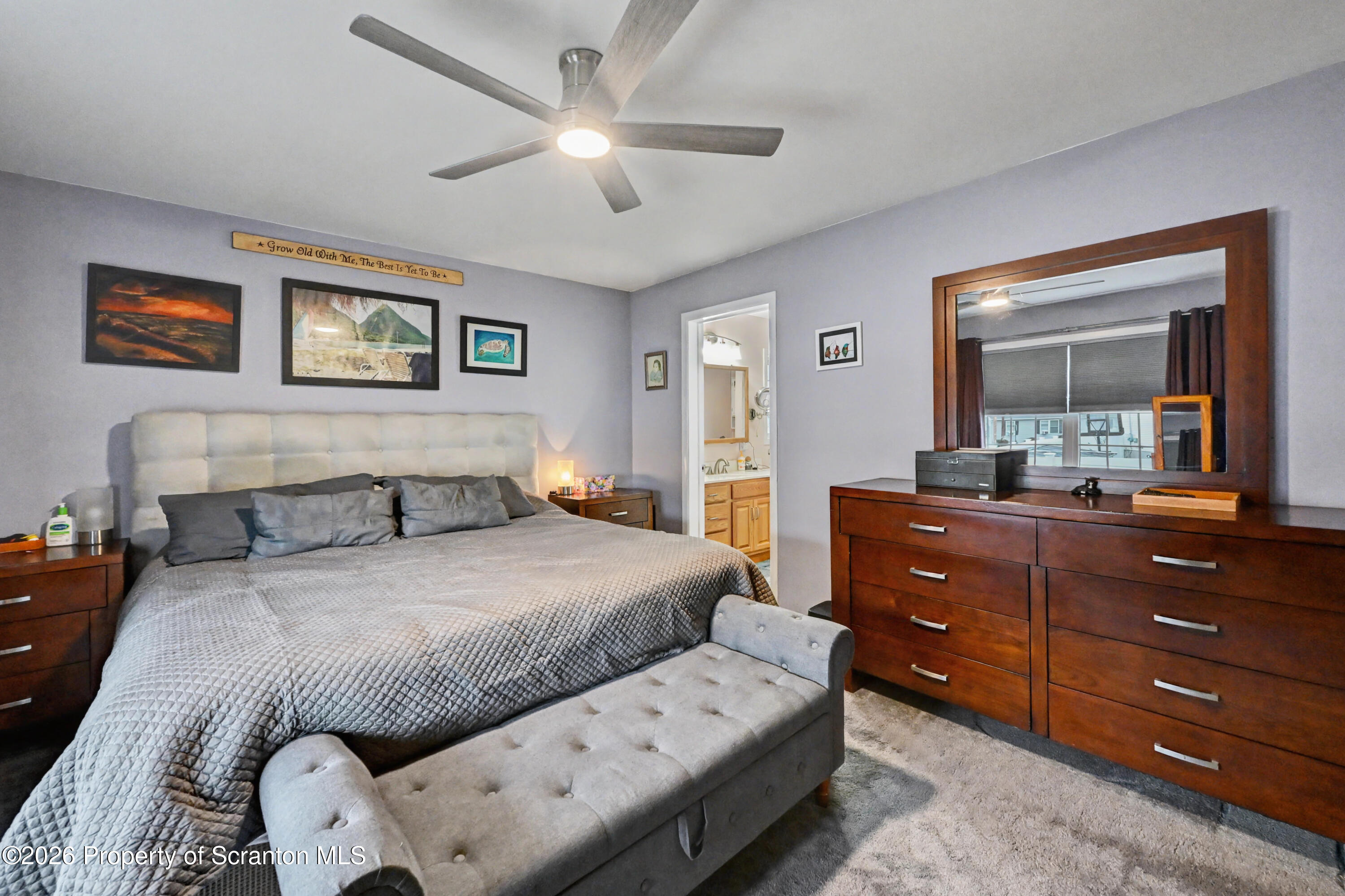 131 Front Street Jessup, PA 18434 - Photo 25 of 58 a bedroom with a bed and a mirror on dresser