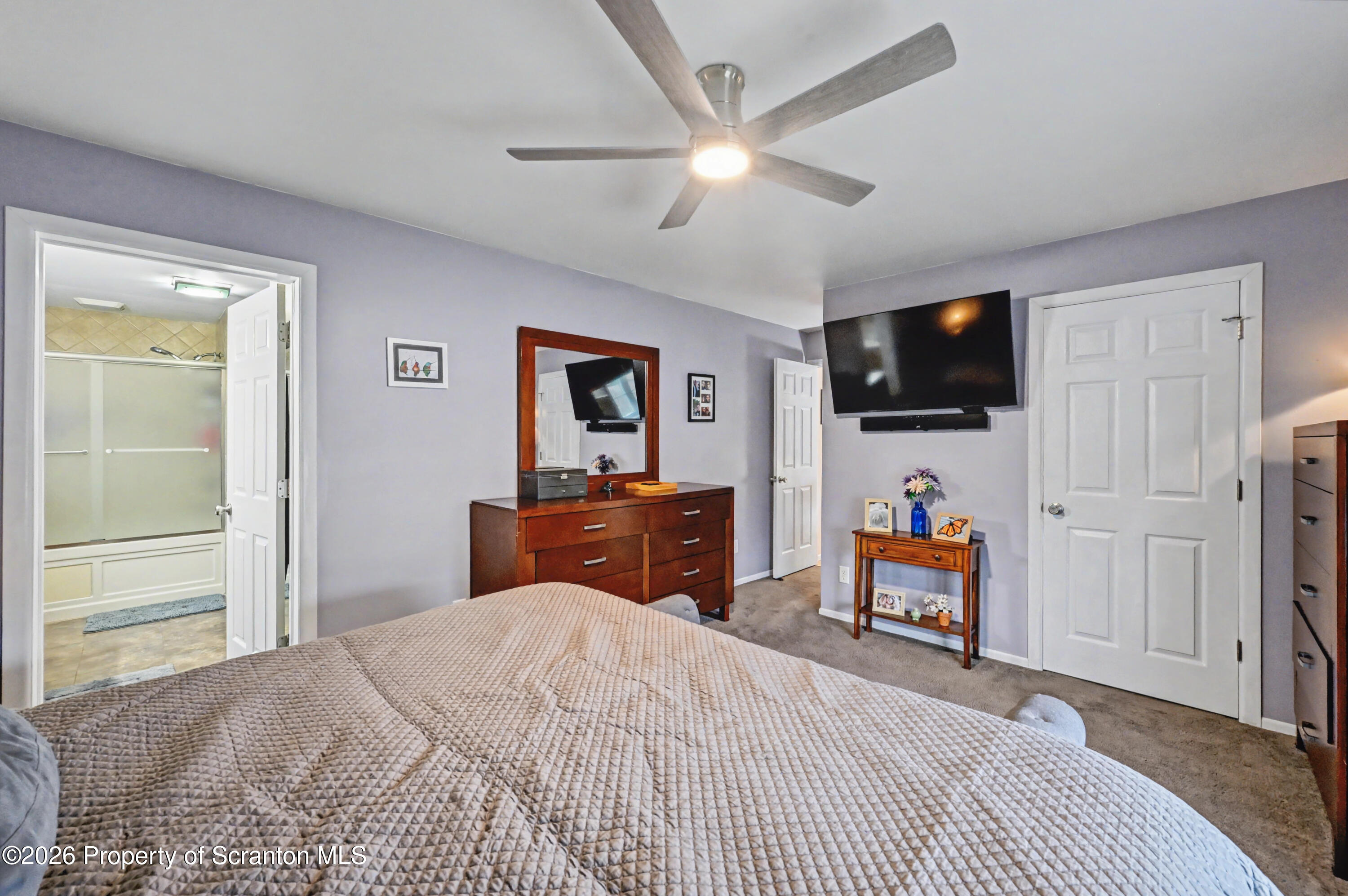 131 Front Street Jessup, PA 18434 - Photo 26 of 58 a bedroom with a bed and a flat screen tv