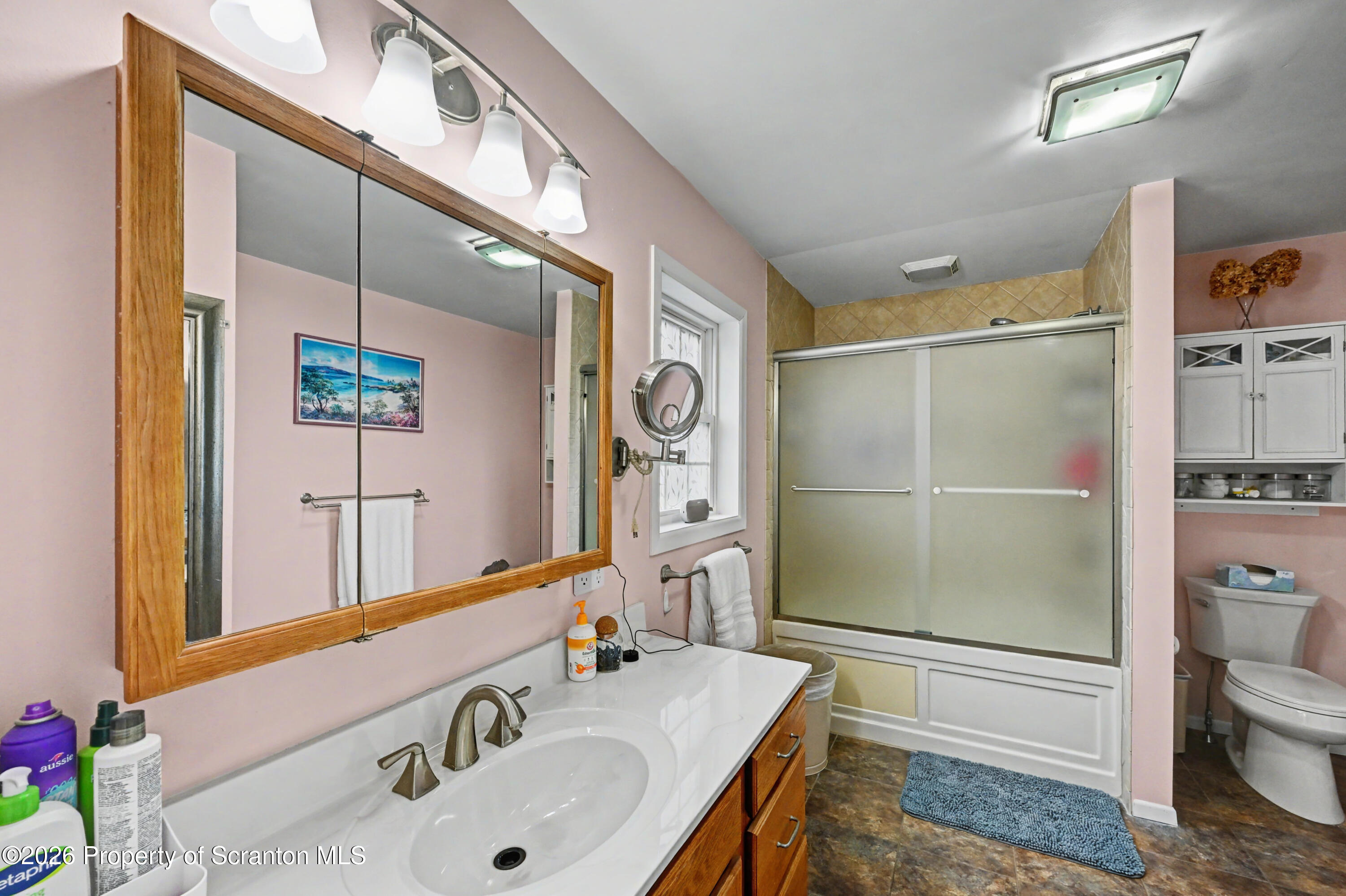 131 Front Street Jessup, PA 18434 - Photo 27 of 58 a bathroom with a sink a toilet and shower