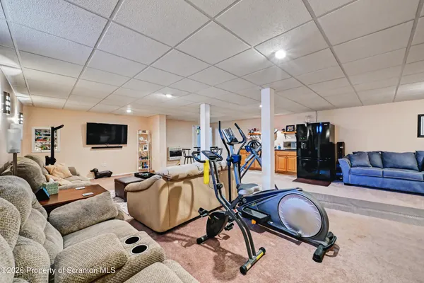 a living room with furniture and a rug