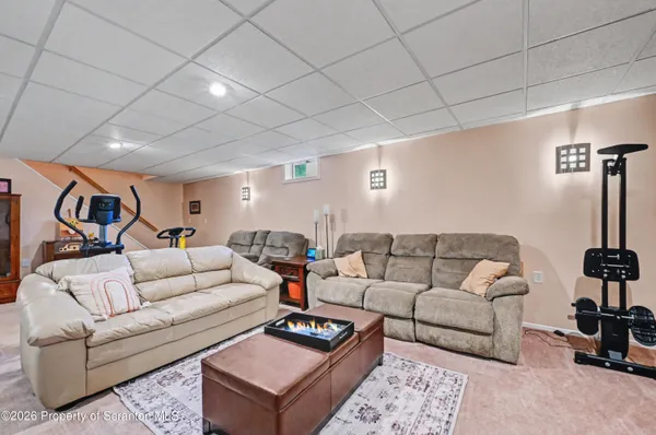 a living room with lots of furniture and a flat screen tv