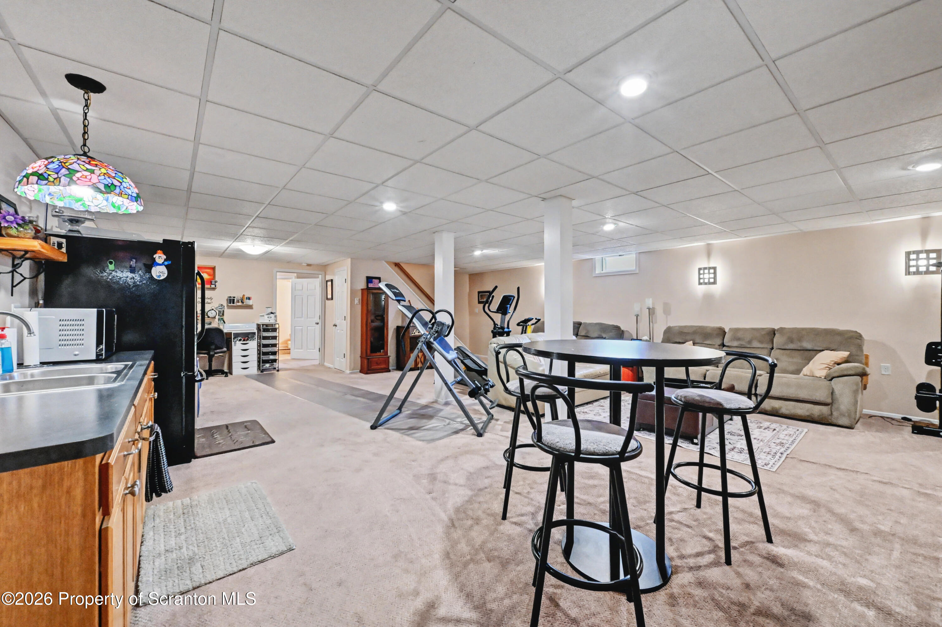 131 Front Street Jessup, PA 18434 - Photo 42 of 58 a view of a dining room with furniture wooden floor and a rug