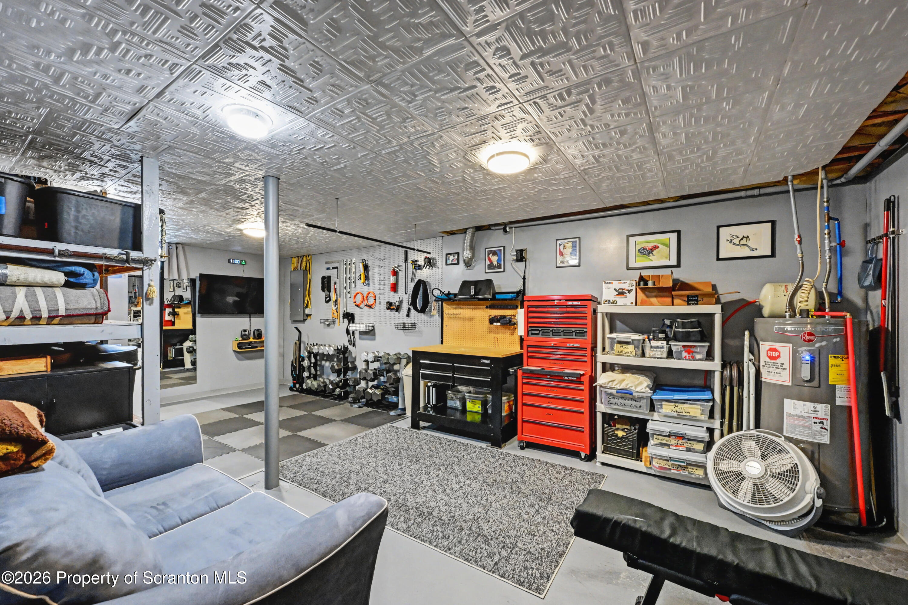131 Front Street Jessup, PA 18434 - Photo 43 of 58 a living room with furniture and a flat screen tv