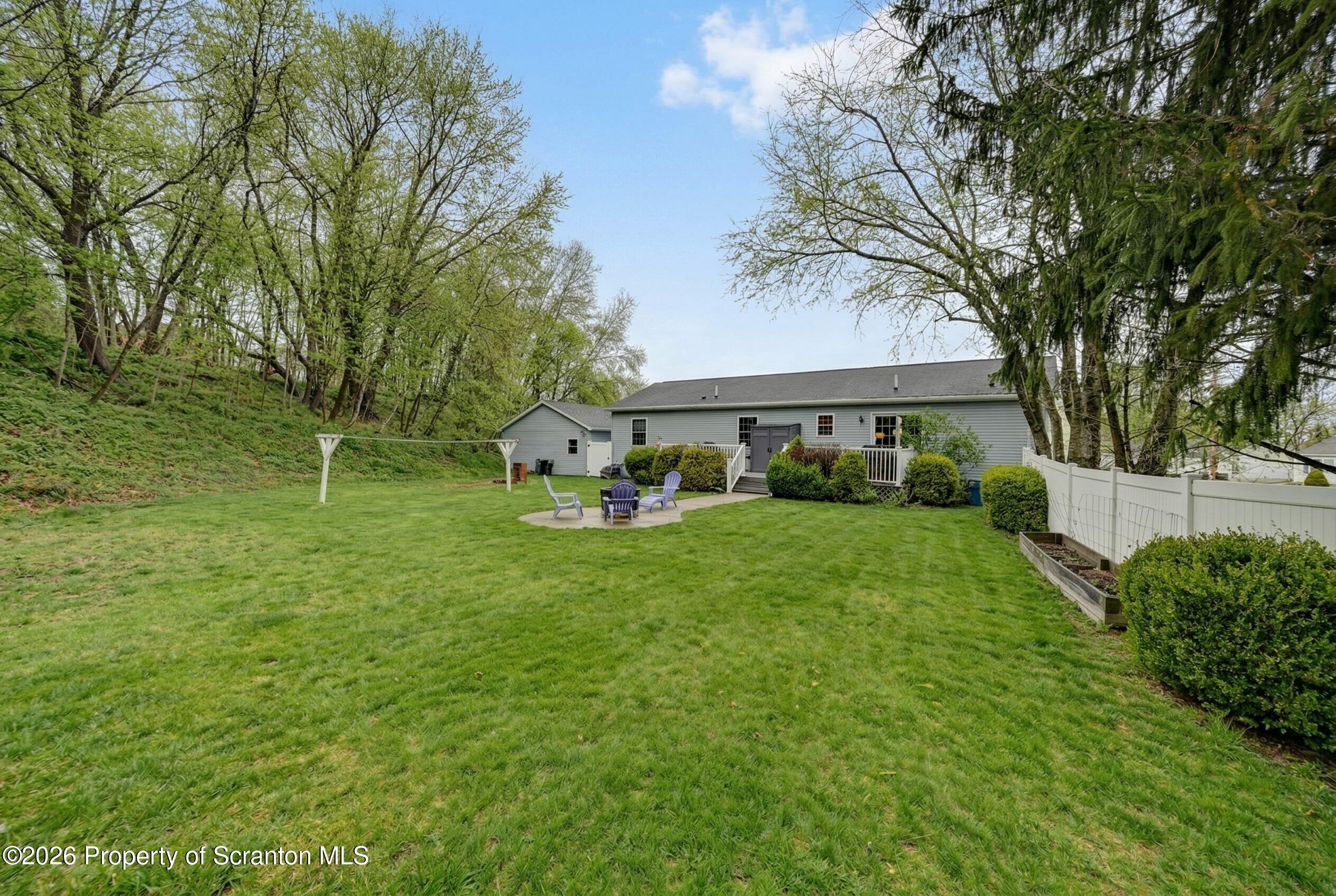 131 Front Street Jessup, PA 18434 - Photo 52 of 58 a view of an house with backyard space and balcony