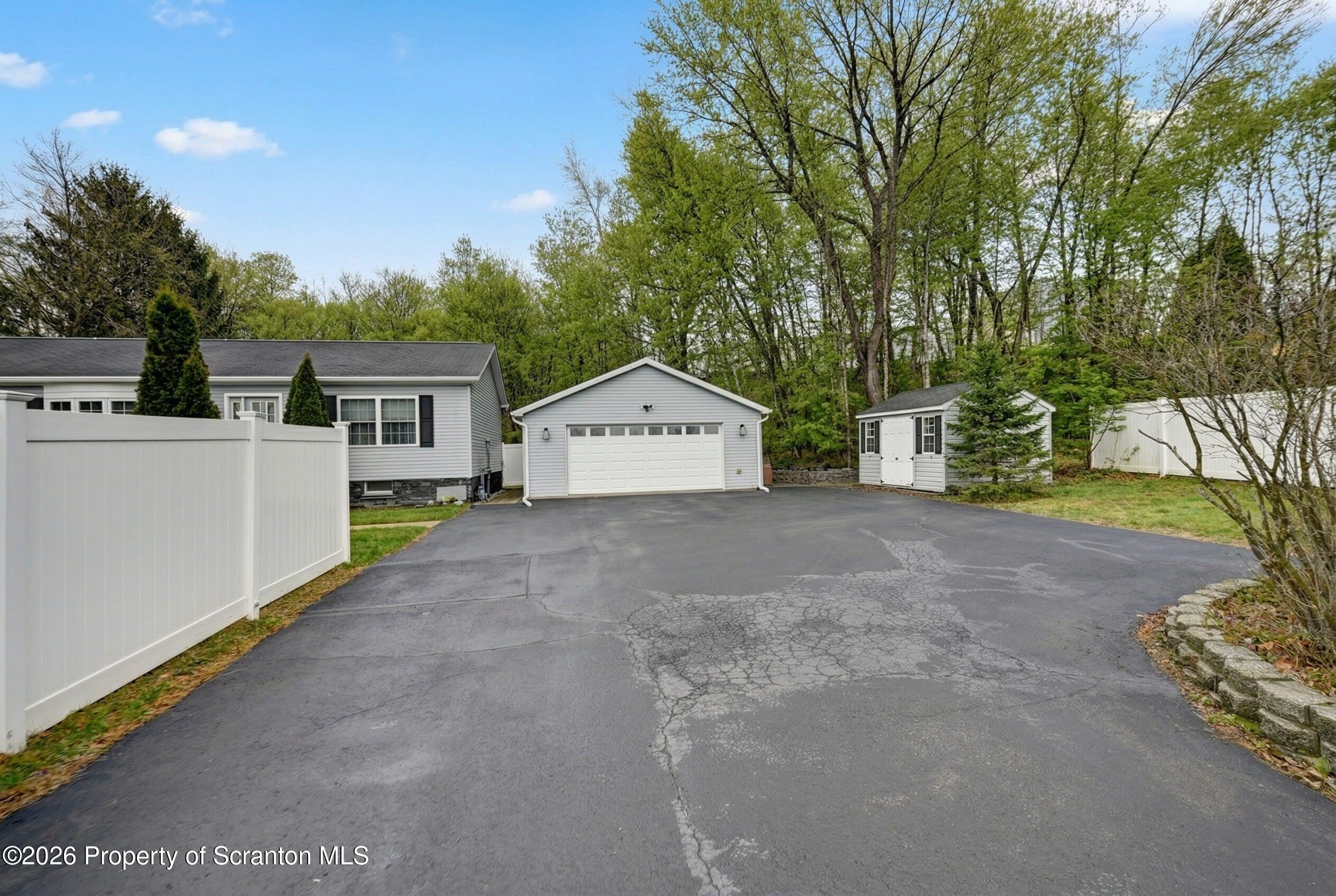131 Front Street Jessup, PA 18434 - Photo 58 of 58 a view of a house with a yard and garage