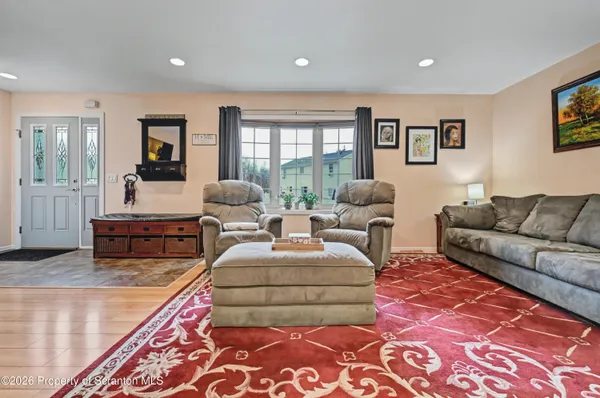 a living room with furniture and a rug