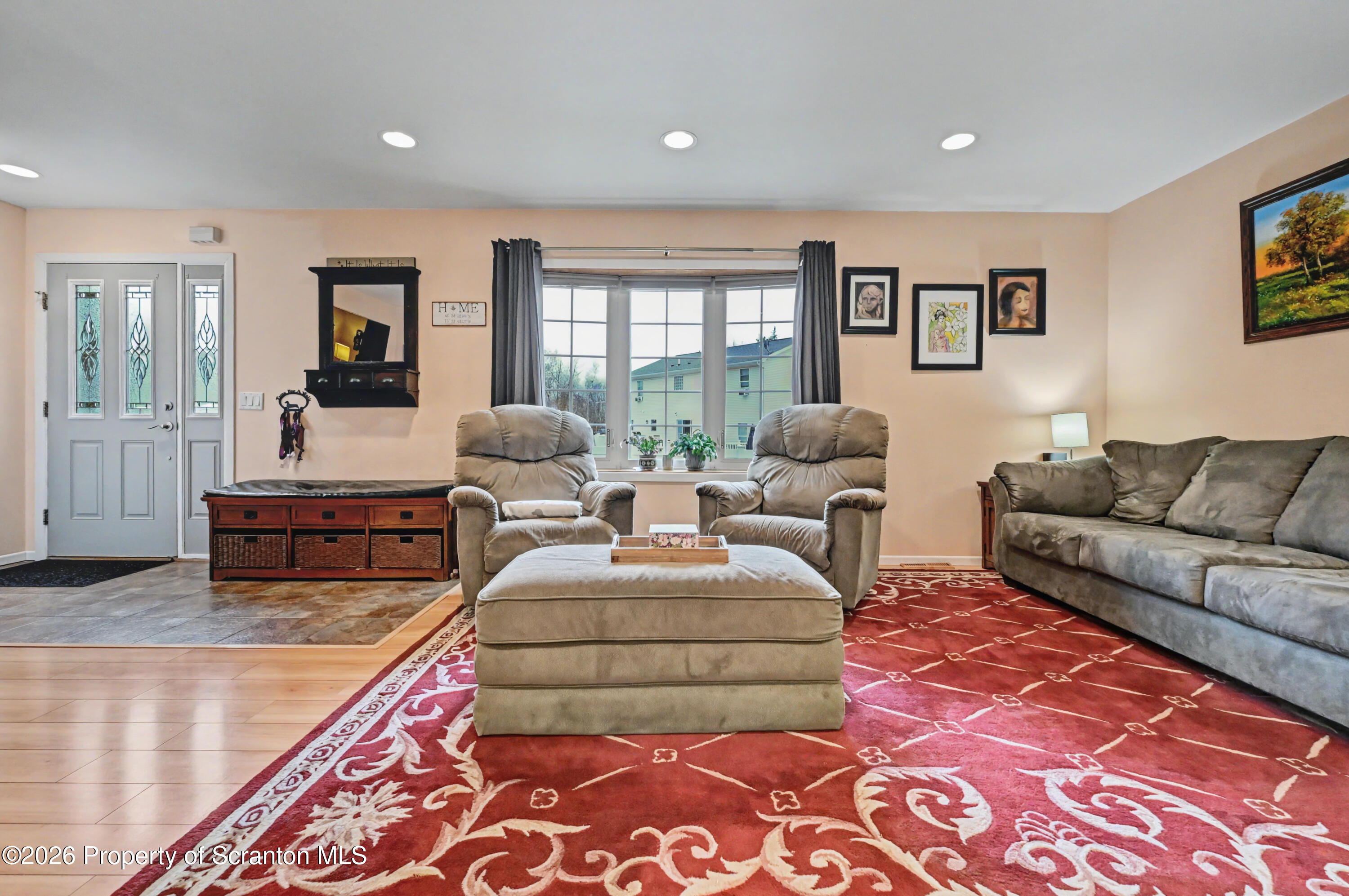131 Front Street Jessup, PA 18434 - Photo 7 of 58 a living room with furniture and a rug
