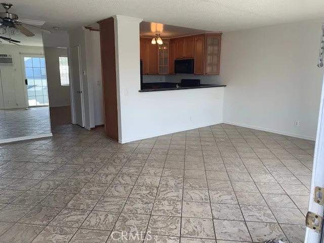 a view of a utility room with cabinets