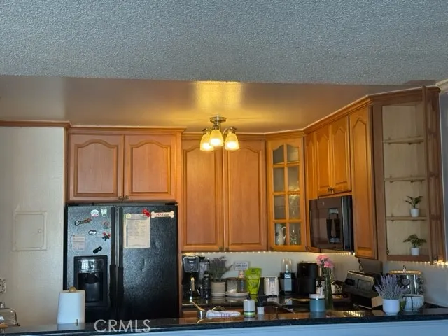 a bathroom with a sink a mirror and a shower