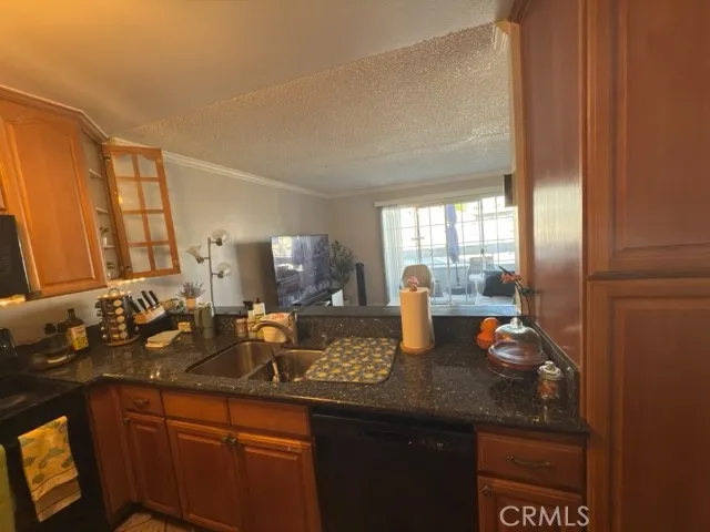 a kitchen with sink and window