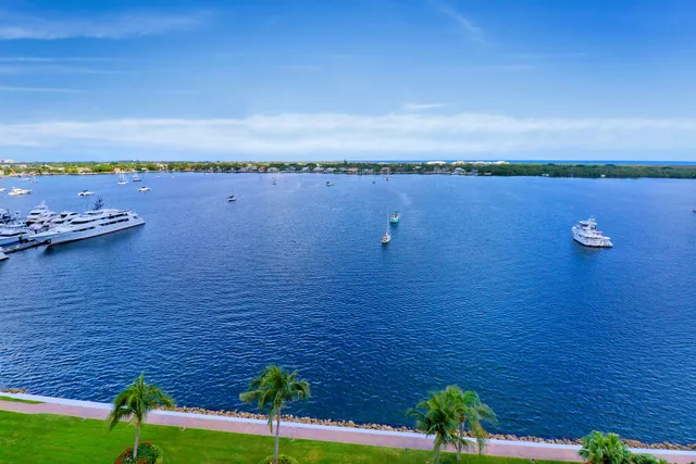 a view of a lake with houses in the background