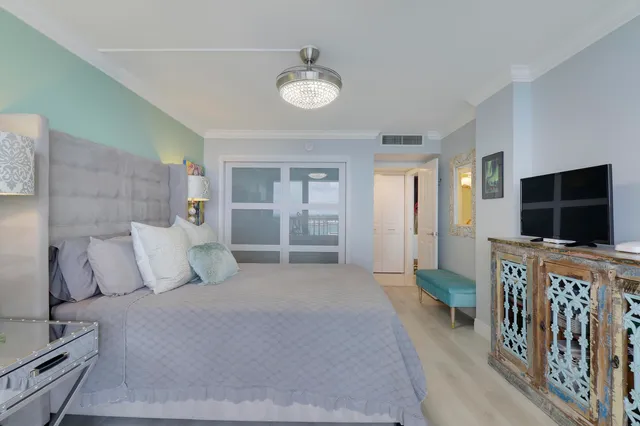 a bed room with a bed and a large window