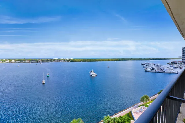 a bedroom with furniture and a flat screen tv