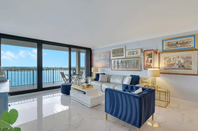 a view of a livingroom with furniture and bedroom view