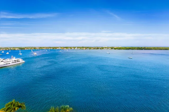 a balcony with wooden floor and city view