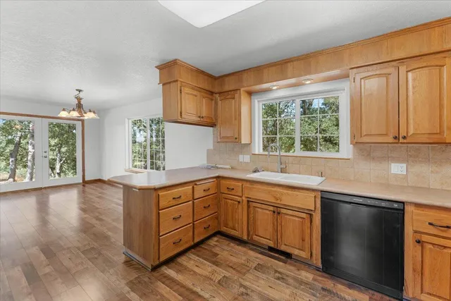 a view of an entryway with wooden floor