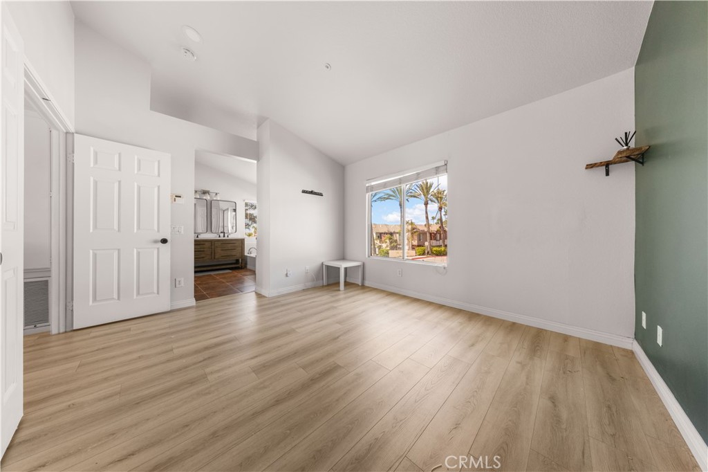 2 Cameron Circle Lake Forest, CA 92610 - Photo 13 of 45 an empty room with wooden floor cabinet and windows
