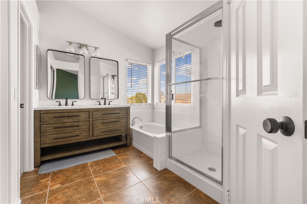 2 Cameron Circle Lake Forest, CA 92610 - Photo 17 of 45 a bathroom with a tub shower and mirror