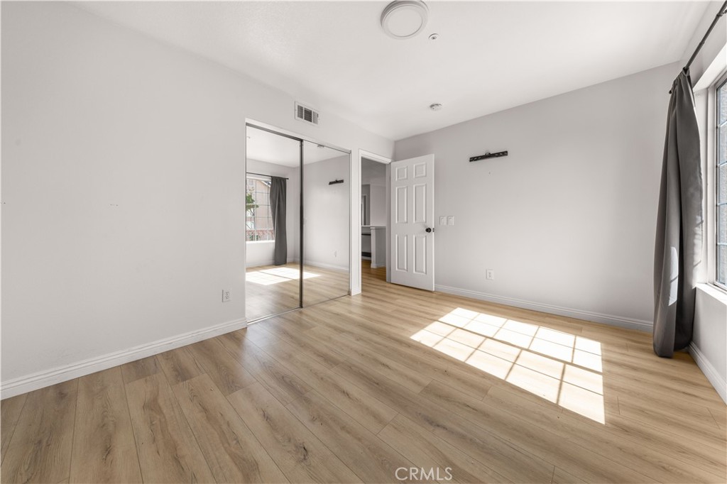 2 Cameron Circle Lake Forest, CA 92610 - Photo 19 of 45 a view of empty room with wooden floor and fan