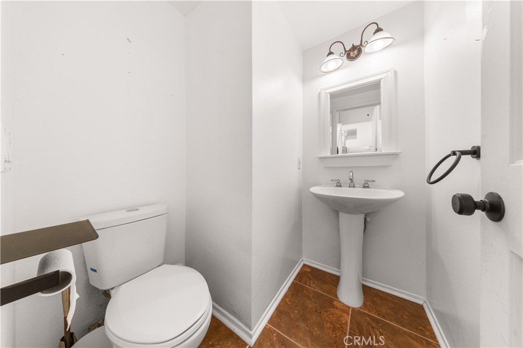 2 Cameron Circle Lake Forest, CA 92610 - Photo 24 of 45 a white toilet sitting next to a bathroom sink