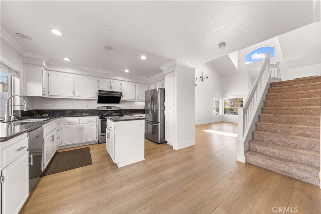 2 Cameron Circle Lake Forest, CA 92610 - Photo 6 of 45 a kitchen with a refrigerator and a stove top oven