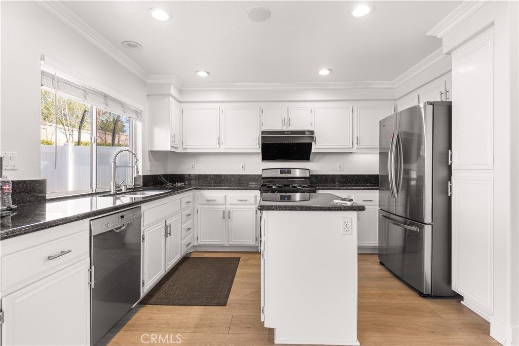 2 Cameron Circle Lake Forest, CA 92610 - Photo 7 of 45 a kitchen with a refrigerator sink and microwave