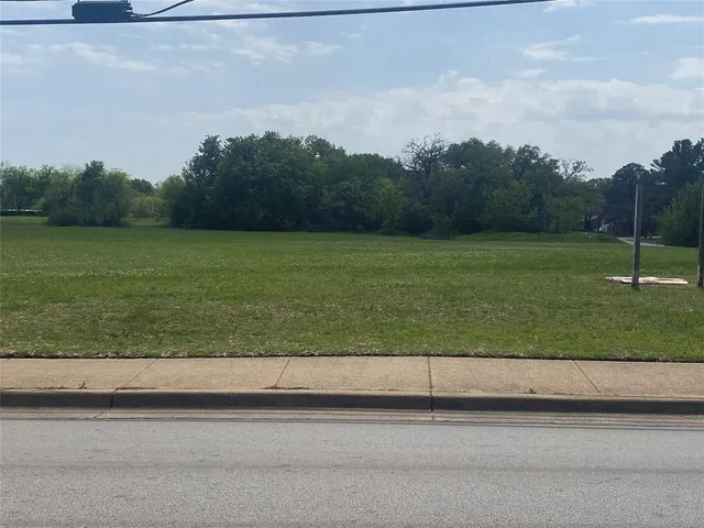 a view of a road from a big yard
