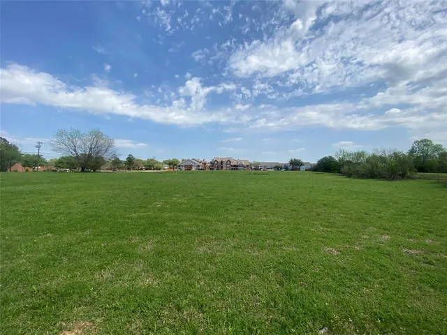 a view of outdoor space with deck and trees