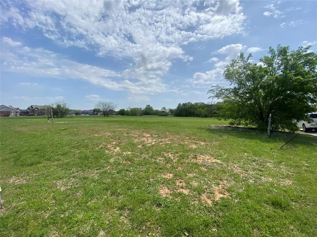 a view of a lake with a big yard