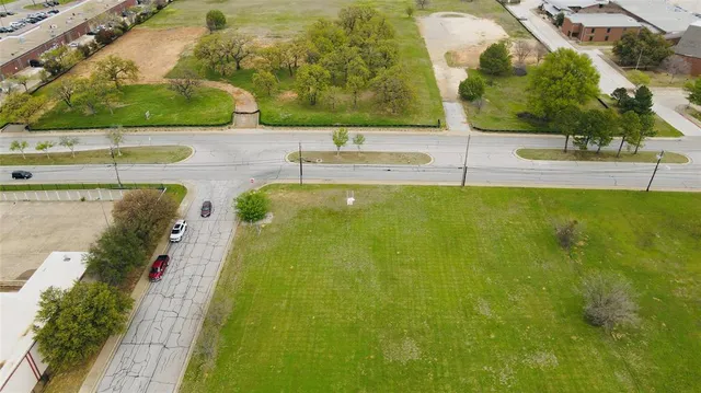 a view of a large yard with an outdoor space and seating area